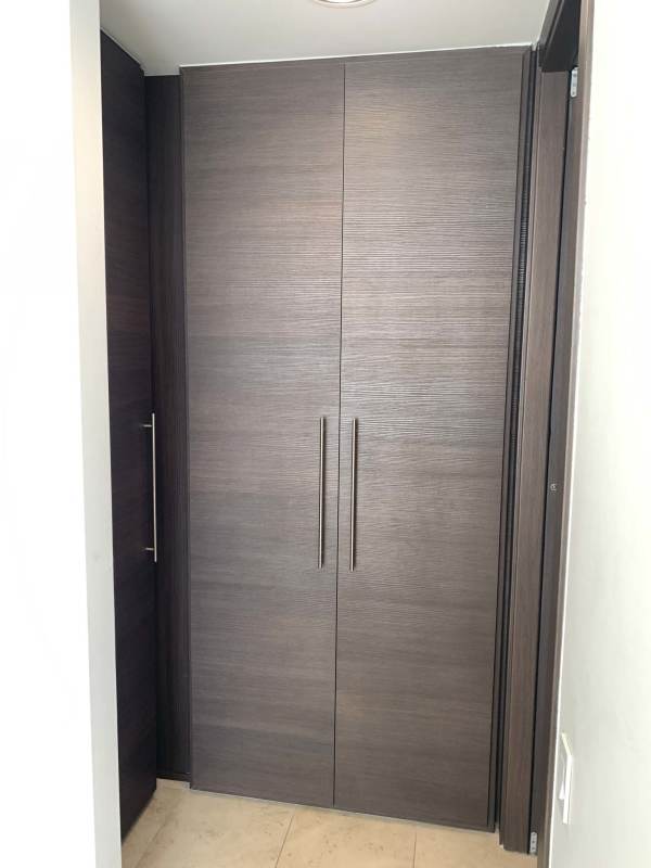 Spacious modern living room with floor-to-ceiling windows and ocean view at Ocean Club Punta Pacifica Panama