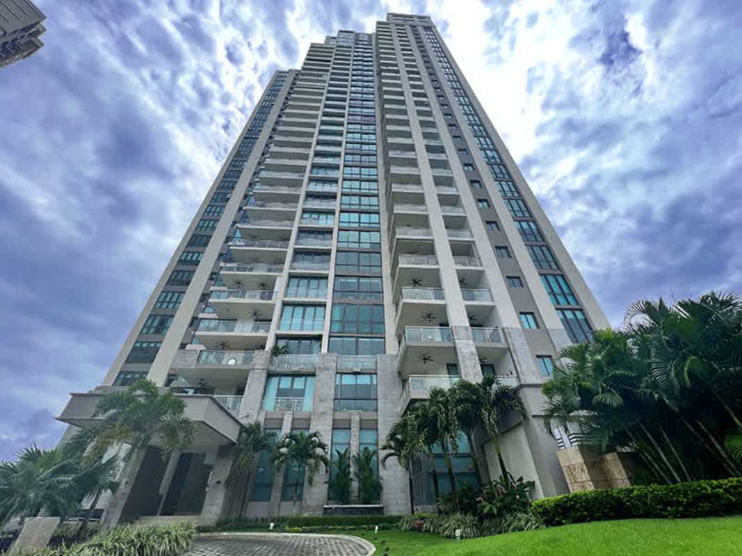 Modern luxury high-rise with terraces and palm landscaping in Santa Maria Golf Panama City