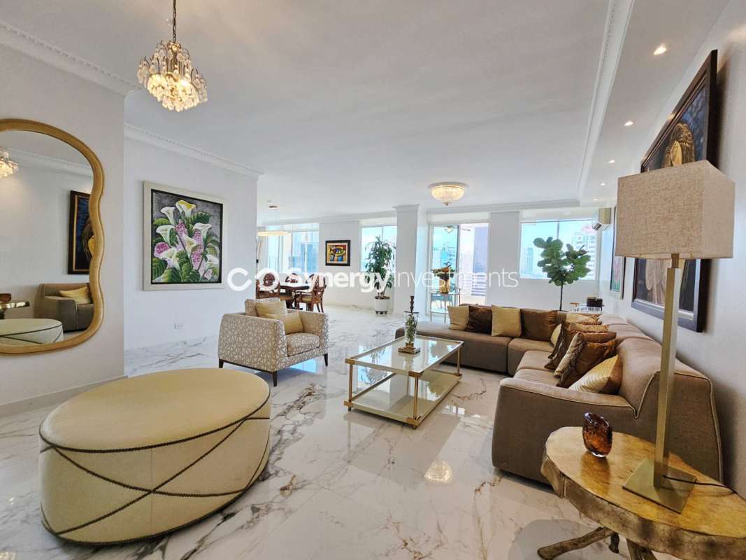 Elegant formal dining area with marble floors, chandelier, modern decor in Obarrio penthouse