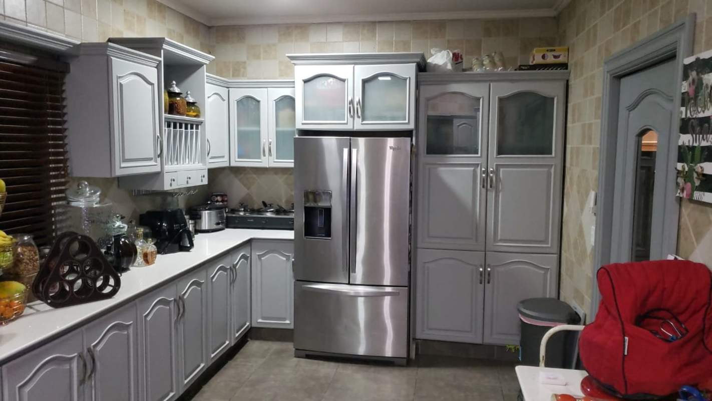 Elegant living dining room with white sofas, holiday decorations in rental Ancon Panama
