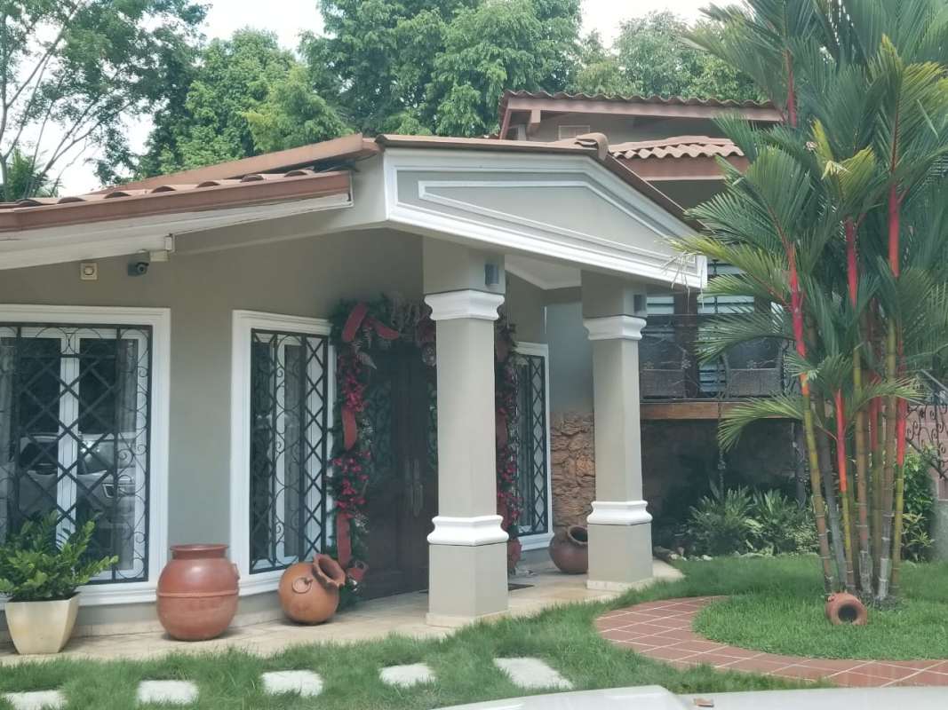 Covered porch with columns and clay pots single family rental house Ancon Panama