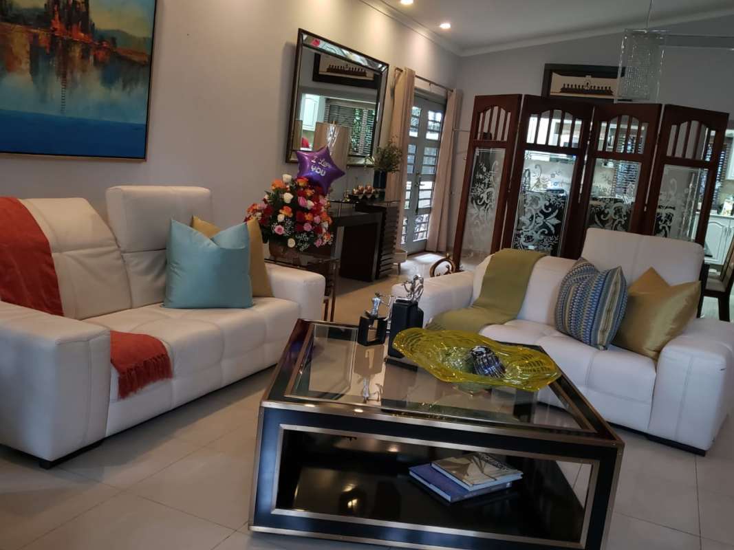 U-shape kitchen with tile backsplash, gray cabinets at house for rent in Ancon Panama City