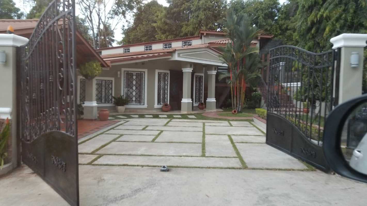 Front garden with porch columns tiled roof rental house near Albrook Panama City