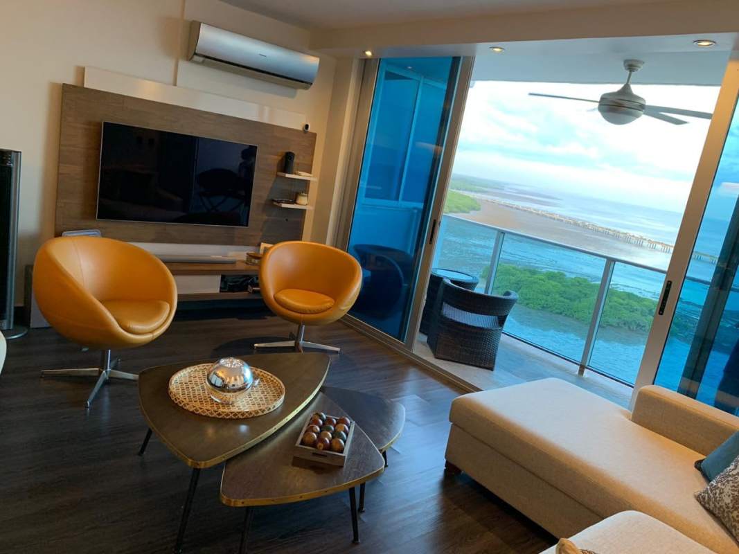 Modern open kitchen with granite countertops and ocean view at PH Coco del Mar Panama City