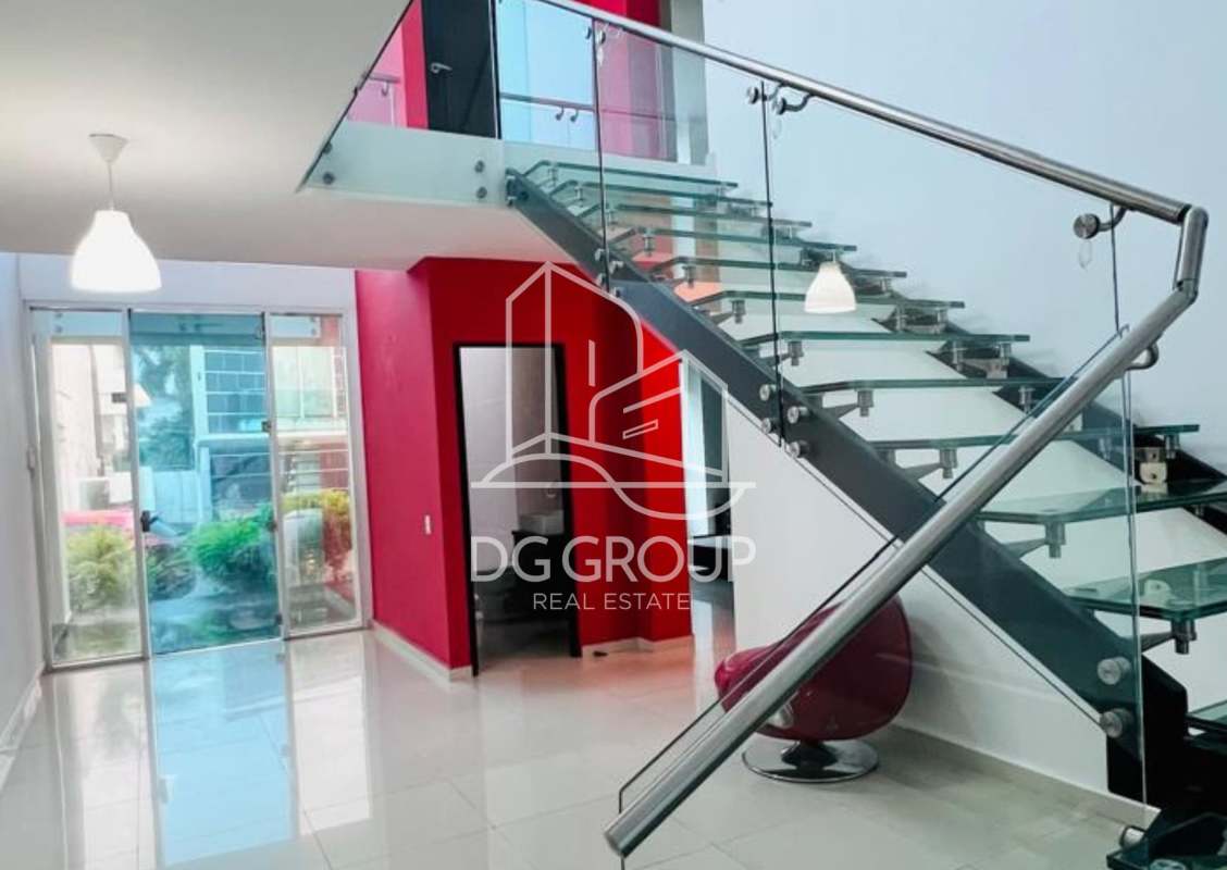 Contemporary kitchen with granite countertops and large windows in PH Costa Esmeralda Panama City