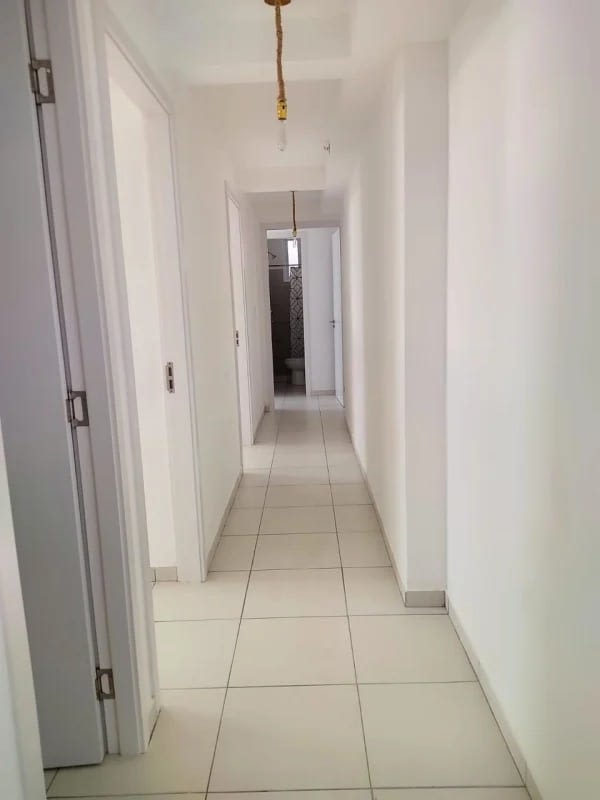 Kitchen with granite countertop, stove, refrigerator, neutral tile backsplash in El Crisol Towers