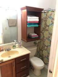 Traditional compact bathroom mirror vanity shelves PH Vistas del Atlántico Colón Panama