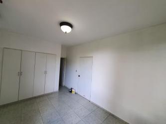 Hallway with tile floor and white walls connecting rooms in PH Vistas del Atlántico Colón Panama