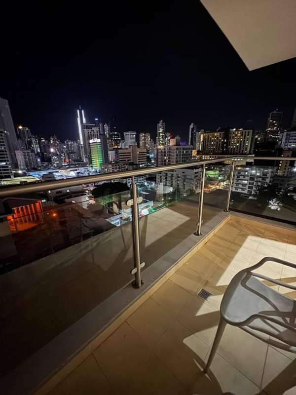 Balcony overlooking Panama skyline at night with glass rail PH Cranc Tower