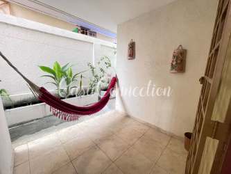Covered patio terrace with hammock and garden views duplex La Fontana David Panama