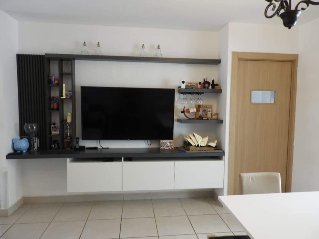 Large outdoor swimming pool with lounge chairs, pergola at Brisas del Golf North Panama