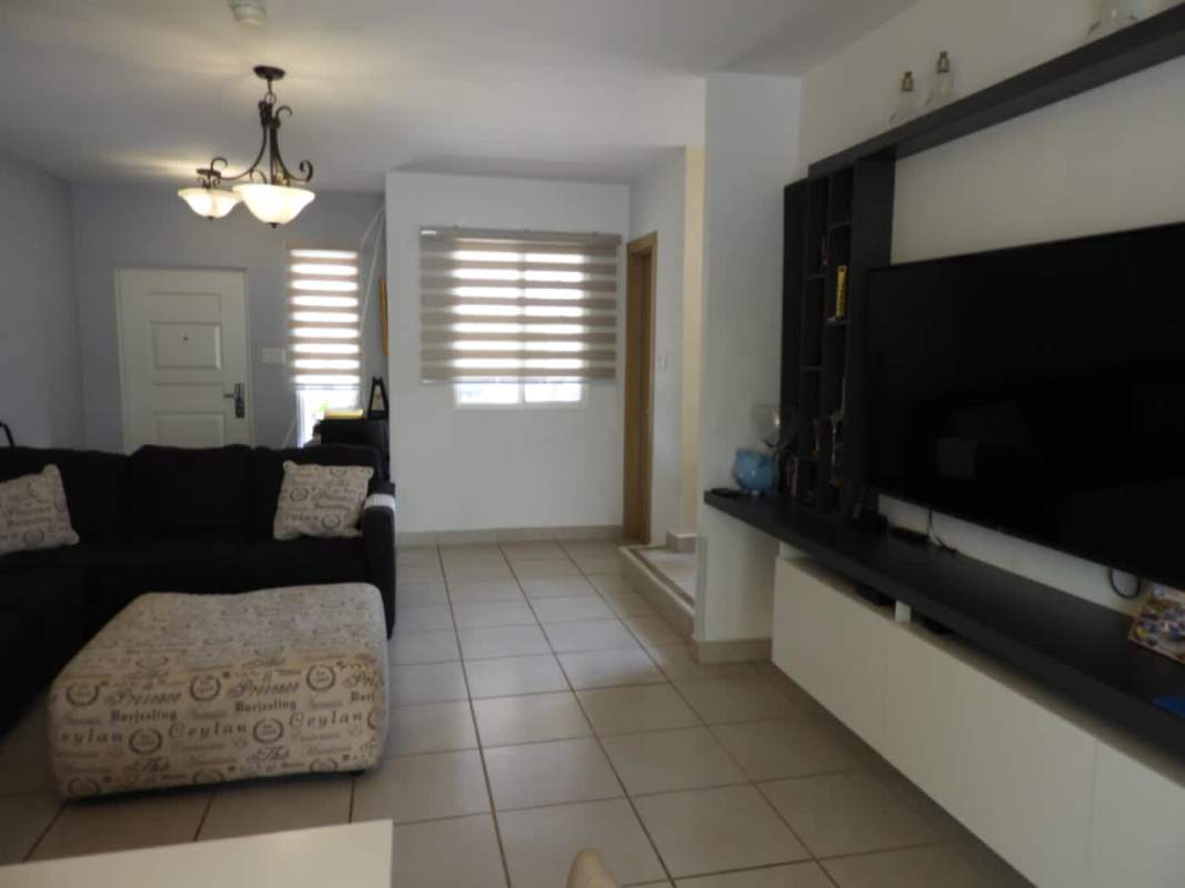 Kitchen with gray cabinets, stainless appliances, tile floor in Brisas del Golf North house for rent