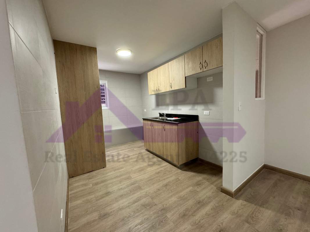 Apartment hallway with modern flooring leading to bathroom at PH Loma de Miramar Panama