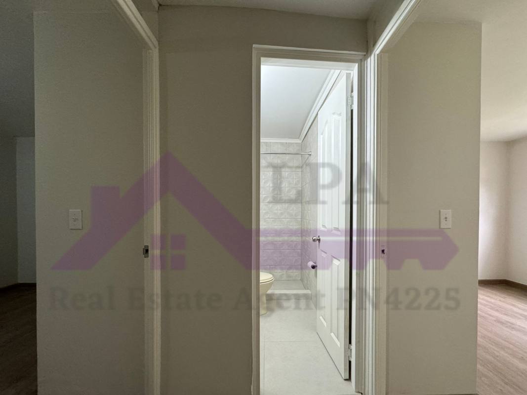 Second bedroom with large window wood floors PH Loma de Miramar Panama