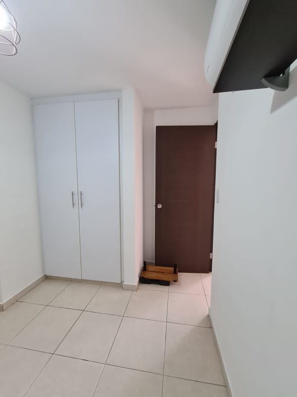Full bathroom with glass shower enclosure and pedestal sink in Panama apartment