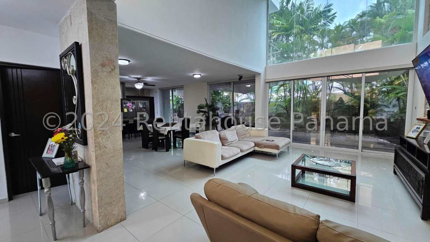 Covered patio with dining area tropical plants tile floor garden view Costa Sur Panama