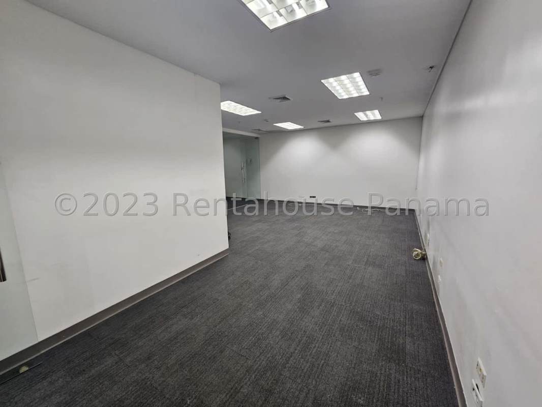 Open-plan empty corporate office space with glass partitions in Costa del Este