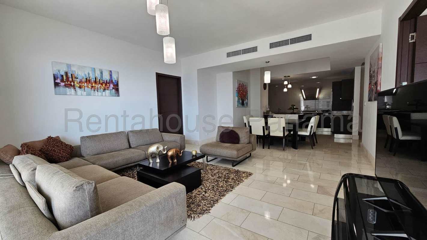 Luxury bathroom with marble counters and glass shower enclosure in Punta Pacifica Panama