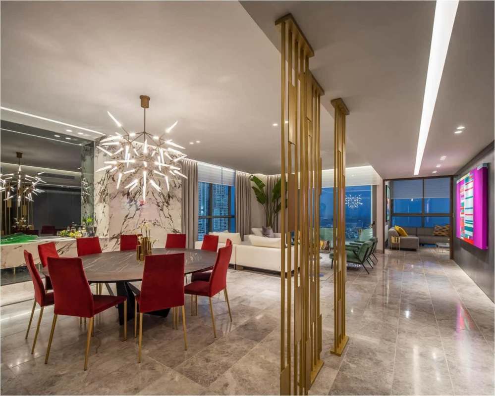 Luxurious open living and dining area with marble walls and city skyline views Punta Paitilla Panama