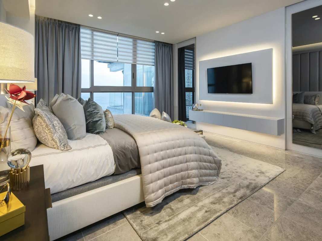 Modern master bedroom with floor-to-ceiling windows and ocean view PH Pacific Point Panama City