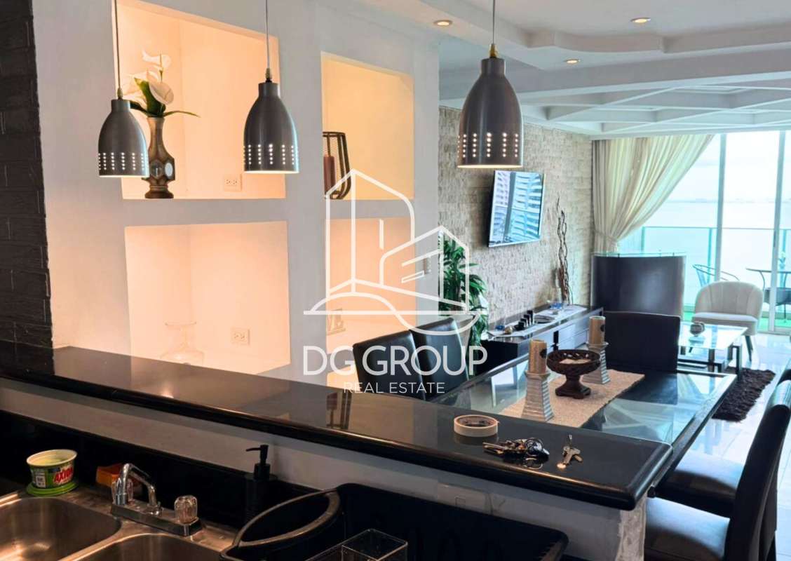 Modern dining area with granite countertop kitchen and stone accent wall PH Pacific Hill