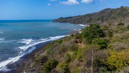 Natural rocky coastline with Pacific ocean waves at beachfront lot Cambutal Los Santos Panama