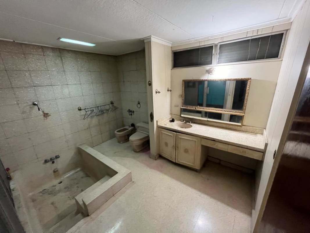 Large pool and patio in spacious backyard in Altos del Golf Panama