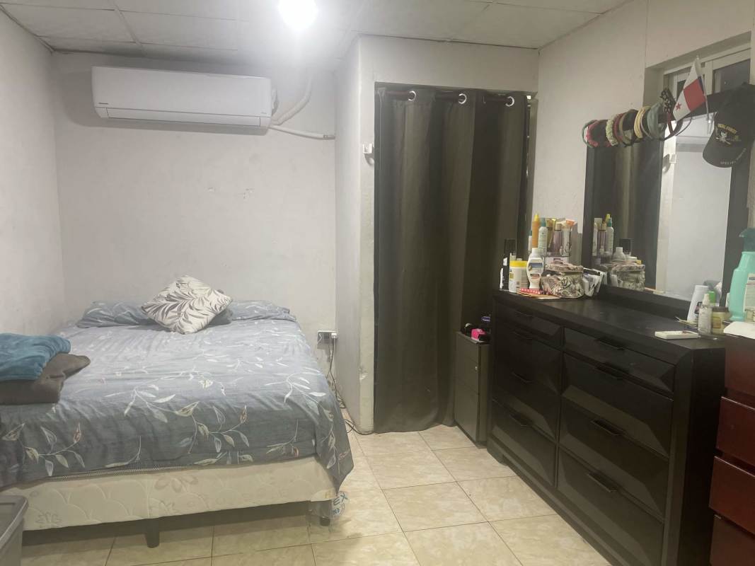 Bedroom with AC unit, dresser, and tiled floor Parque Santa Lucía Tocumen Panama