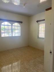 Open covered patio area with garden views and tiled floor La Enea Guararé Panama