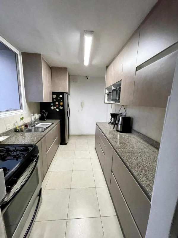 Modern galley kitchen with granite countertops appliances PH Bella Vista Park Panama City