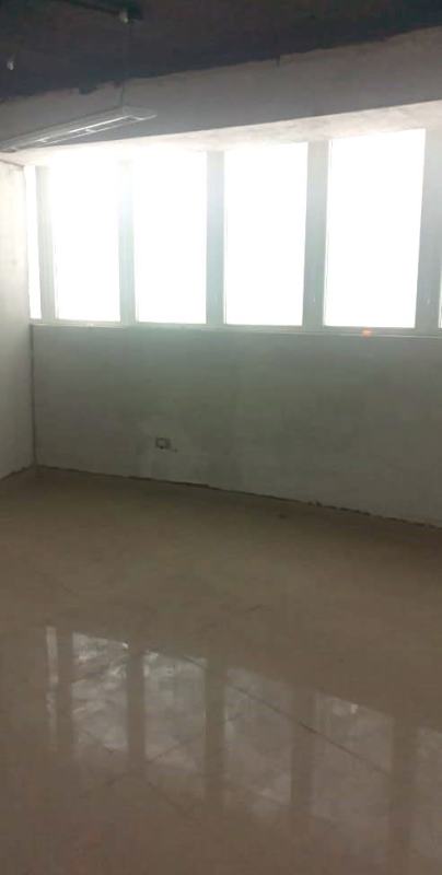 Empty office room with large windows for natural light in PH BICSA Tower Panama