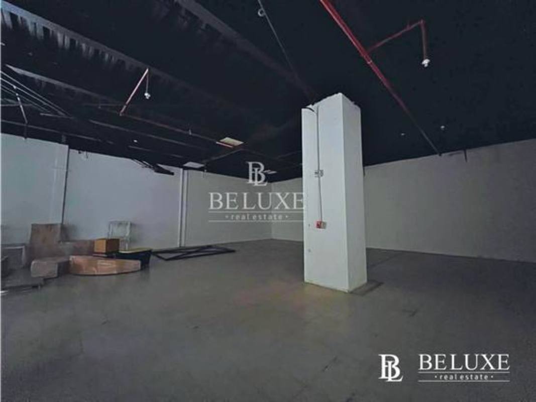 Industrial style commercial warehouse interior with exposed pipes, concrete floor and beams El Cangrejo Panama