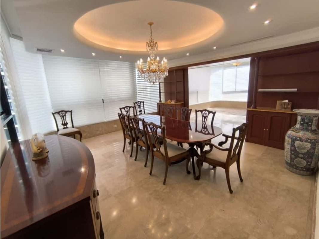 Luxury apartment dining room marble floor chandelier built-in wood shelves PH Mirage Panama City