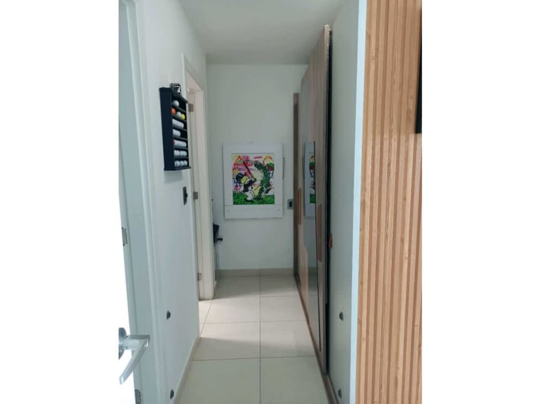 Modern dining space opens to balcony with oceanfront views in Coco del Mar Panama