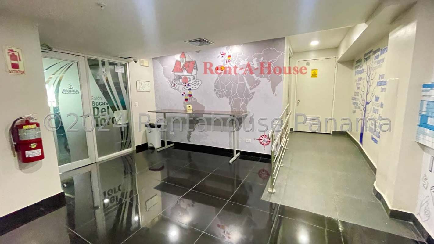Commercial lobby with glossy black floor and wall decorated with world map in Bella Vista Panama