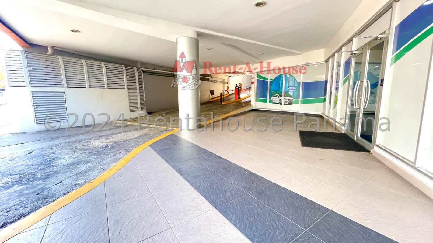 Parking entrance with glass doors and security gate in PH Corporate Tower Panama