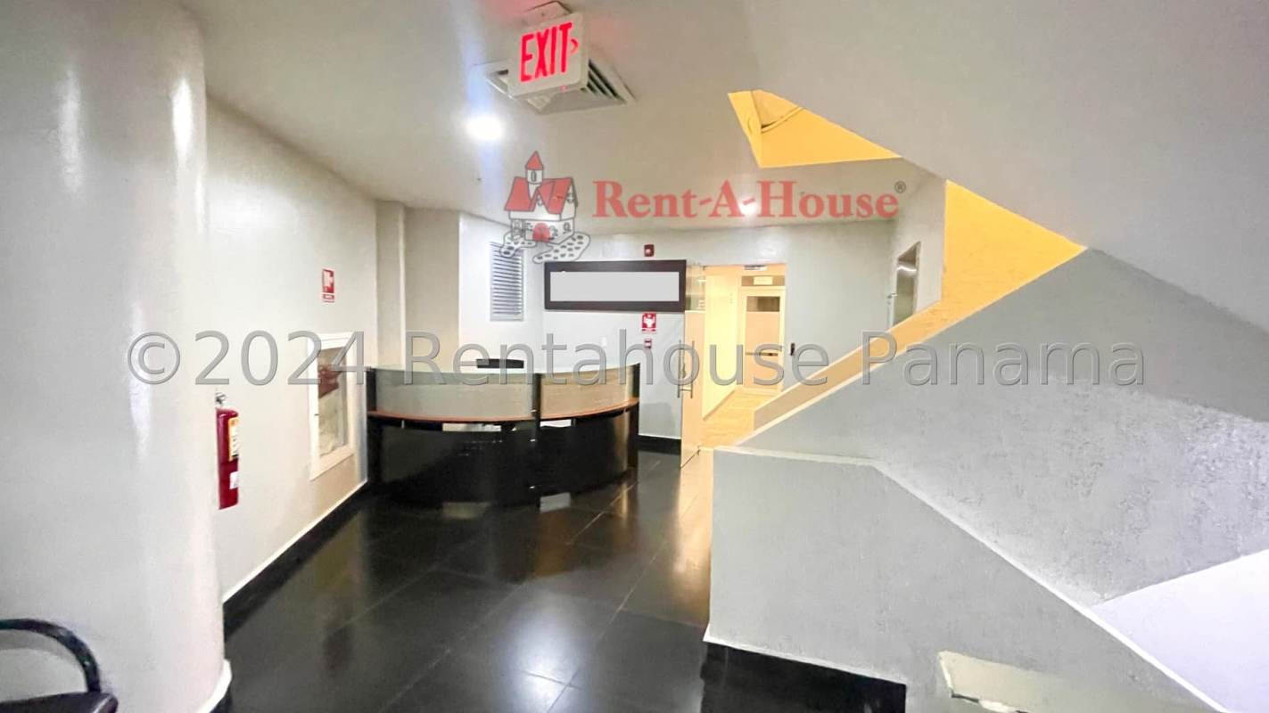 Contemporary commercial building facade with glass windows and brick accents in Panama City banking district