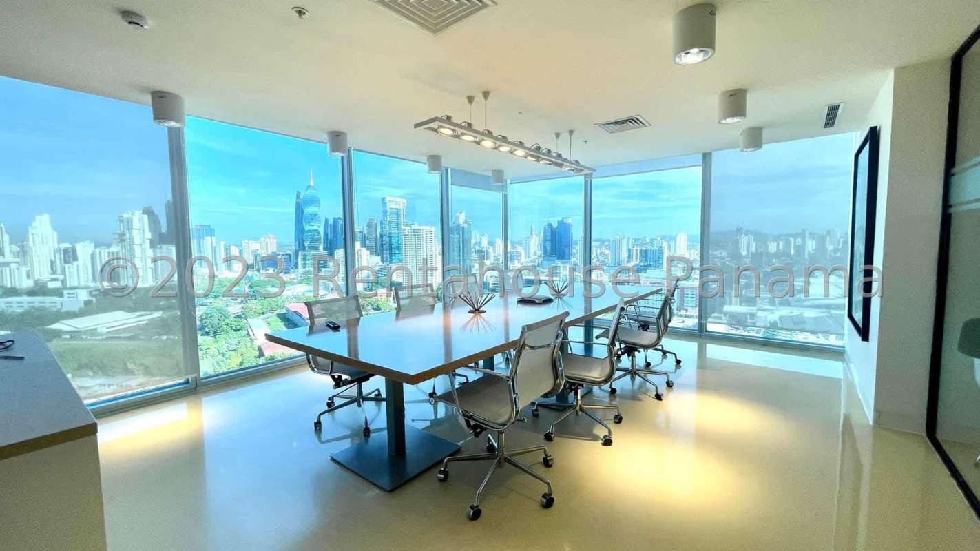 Large open-plan workspace area with glass partitions in PH Oceania Punta Pacifica Panama