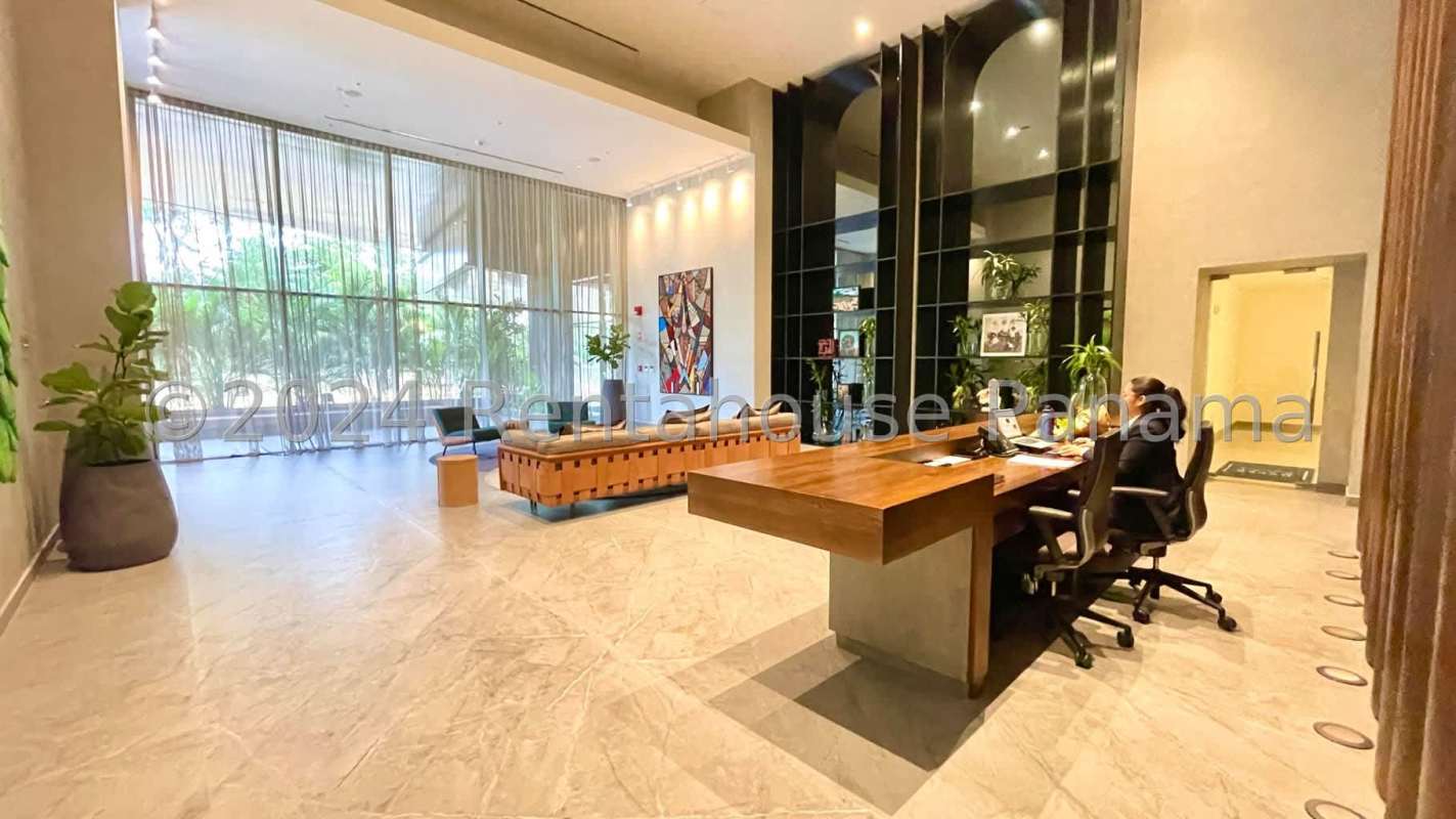 Modern walk-in closet with built-in drawers and hangers inside luxury apartment Costa del Este Panama