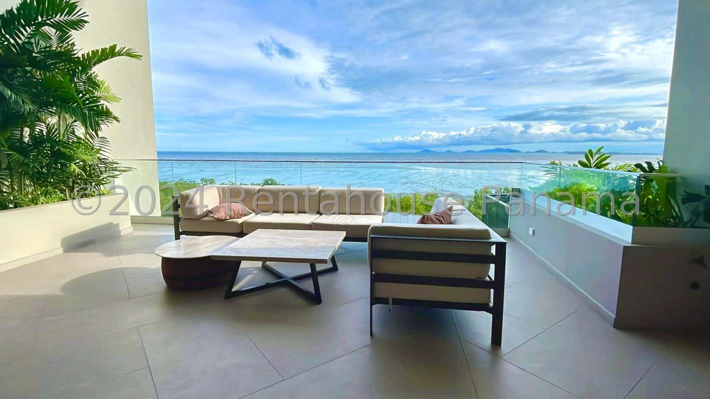 Large terrace with glass railing and ocean view from luxury apartment in Upper East Tower Panama