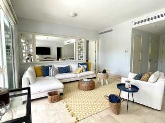 Open kitchen with granite counters and stainless appliances in beachfront condo Buenaventura