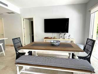 Bright second bedroom with large windows facing marina Buena Ventura