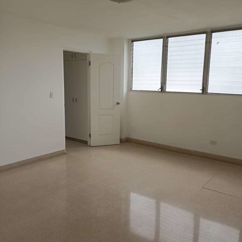 Kitchen with ample storage minimalist neutral tones Obarrio apartment Panama
