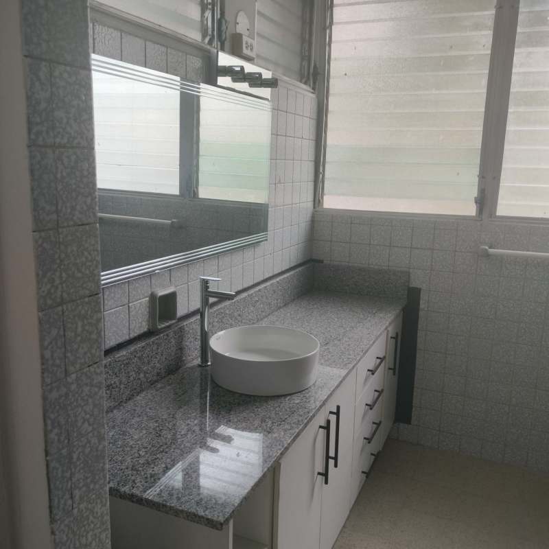Modern bathroom with granite vanity and vessel sink Calle 50 apartment Panama