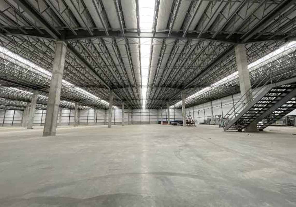 Modern industrial warehouse exterior with loading docks, ramps and metal canopies Tocumen Panama