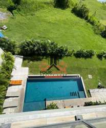 Modern swimming pool area surrounded by lush gardens at PH Solaria in San Carlos Panama