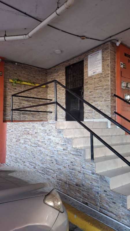 Entrance to PH Mystic Park with stone-patterned walls stairs and security door