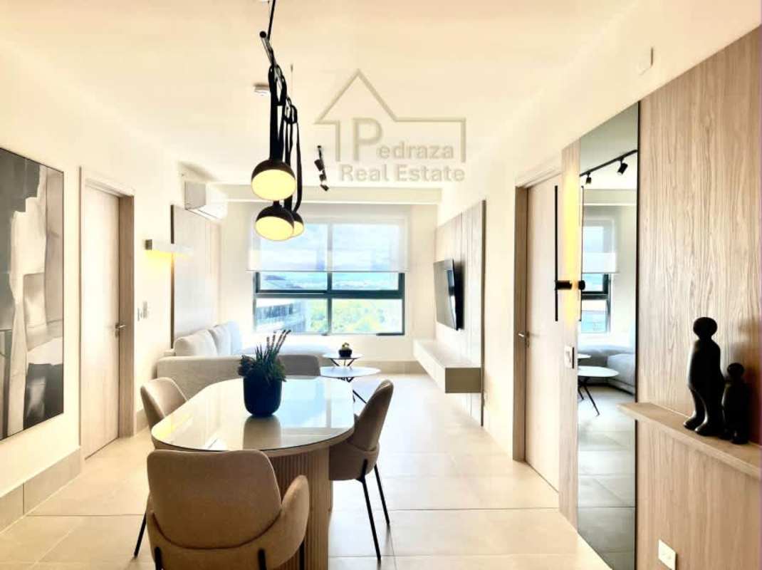 Bedroom with modern upholstered bed, textured panels and lighting PH Ocean House Panama