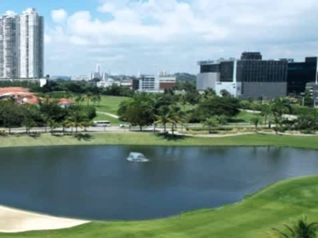 Resort-style pool with loungers and skyline view The Reserve Santa María Panama