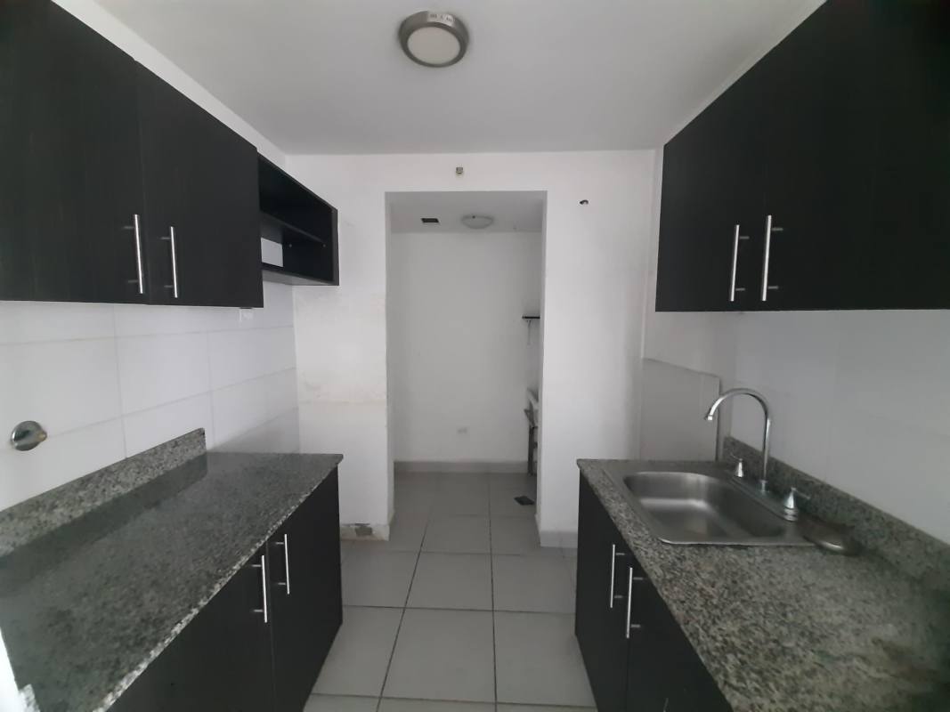 Kitchen with granite counters, dark cabinets, tile floor in PH Premium apartment Via España Panama